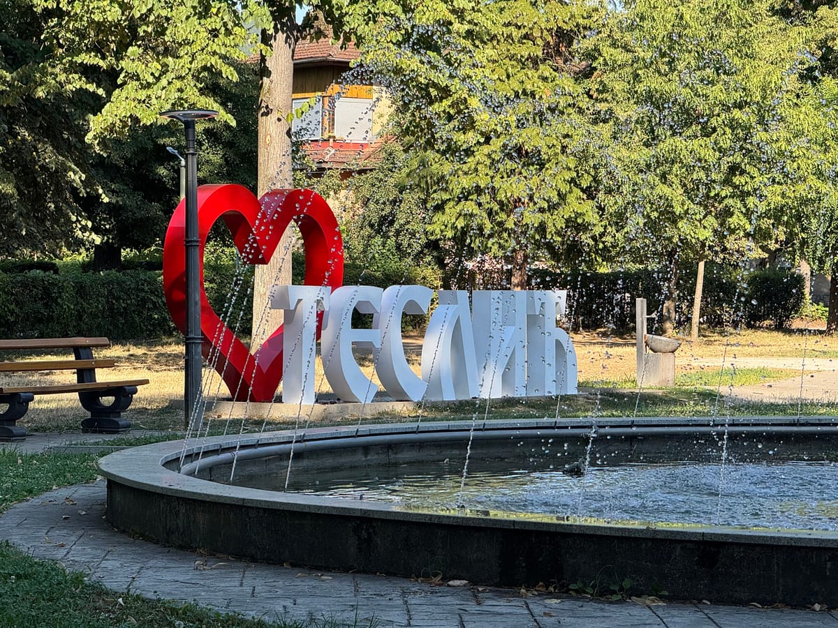 Fountain and town sign in the city park in Teslić